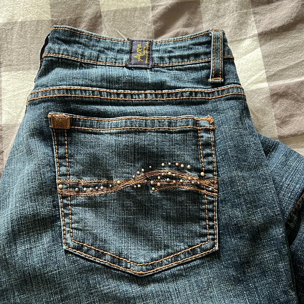Mid rise boot cut aura wrangler jeans